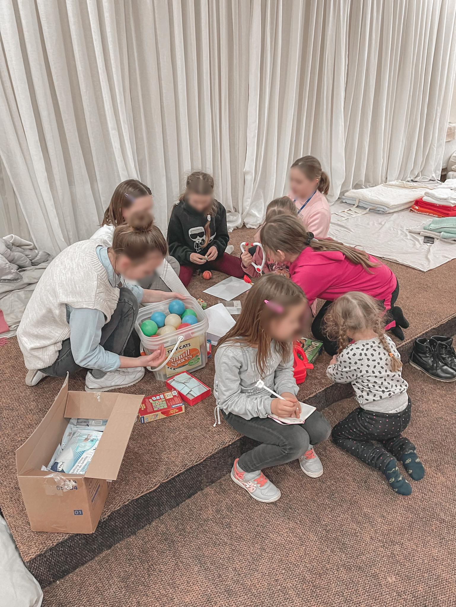 Ukrainian Refugee kids opening Operation Christmas Child boxes - 5.jpeg