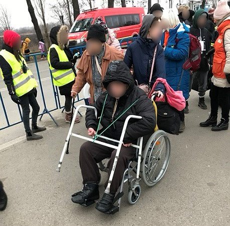 Man in wheelchair at border - C.jpeg