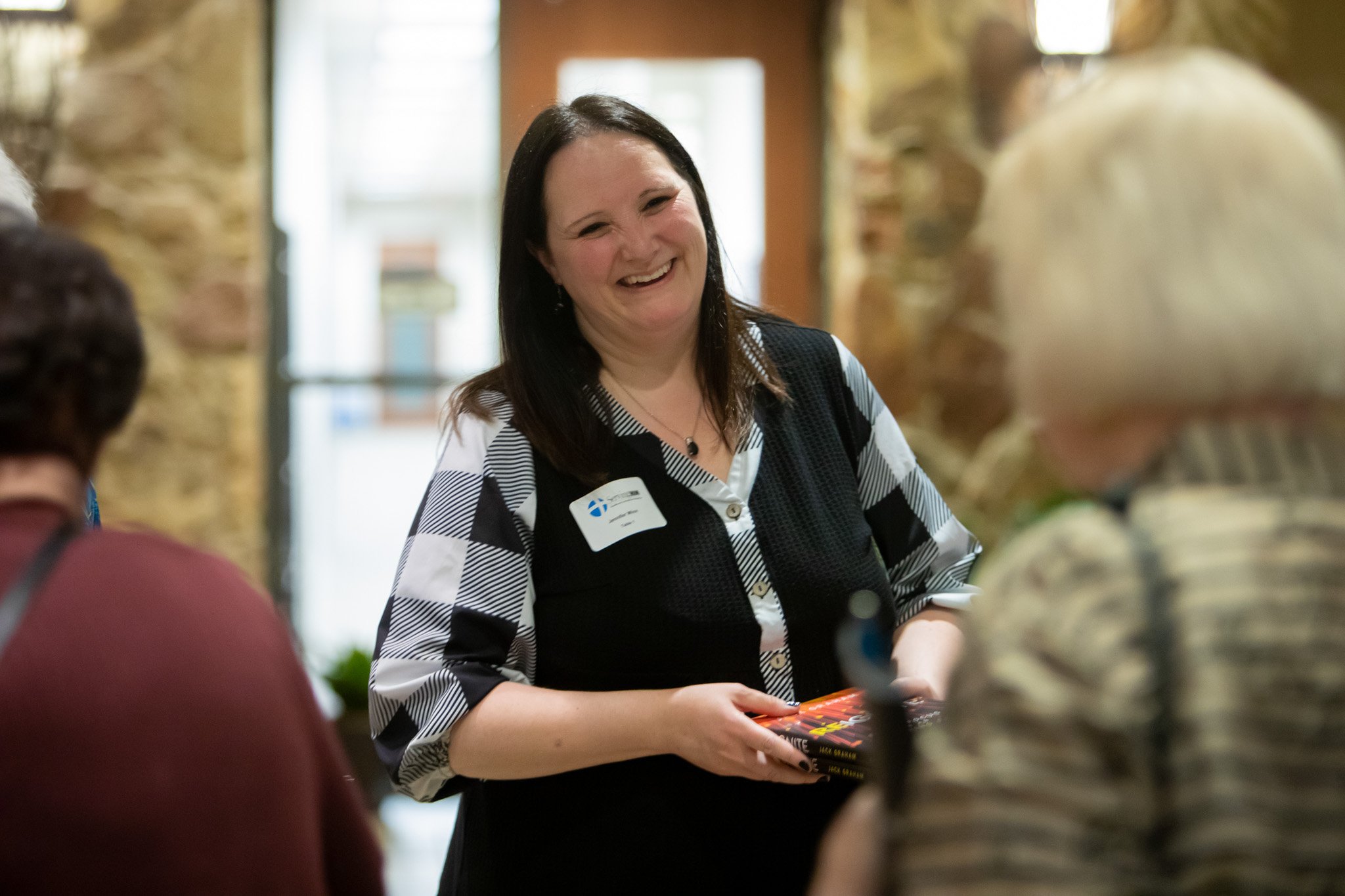 1S2A4321 Jennifer handing out books.jpg