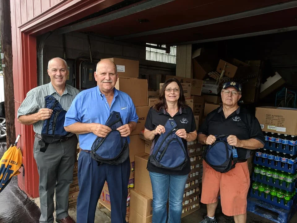 Pictured left to right: Jeff Amos (A&A Grocery), Mark Kimmel (Kimmel Corporation), Elks Officer Tammy Groves, and Elks Officer Dan Smith.
