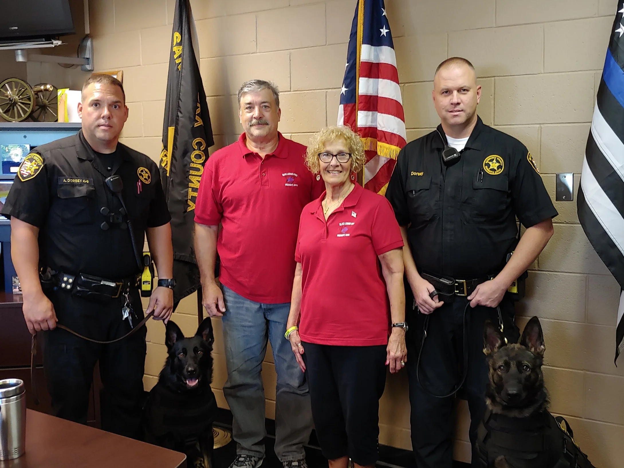 Pictured from left: Officer Allen Dorsey with Eda, Fremont Elks Exalted Ruler Mike Mowry & Mary Beaston, and Officer George Dorsey with Hayes
