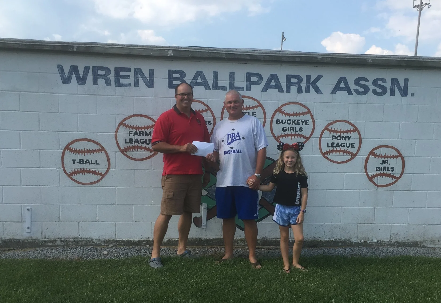 Shown are, left to right, Shane Mills representing the Golf Committee presenting the check to Jeremy Kitson of the Wren Ball Park Association.