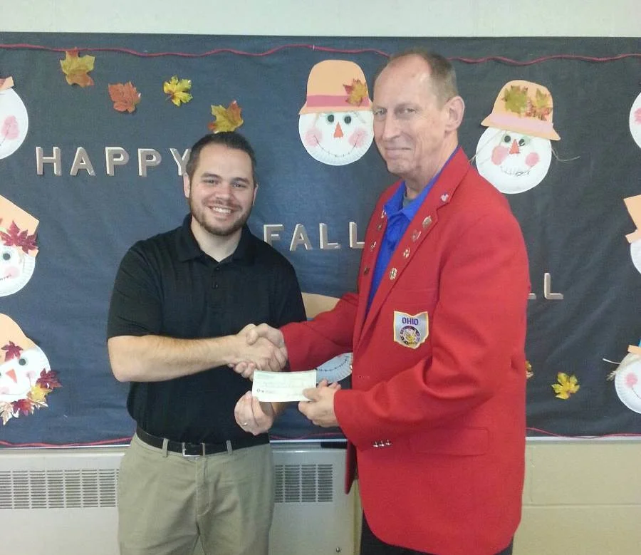 On the left is Principal Andrew Garber accepting the check from Wayne Gorby, Exalted Ruler.
