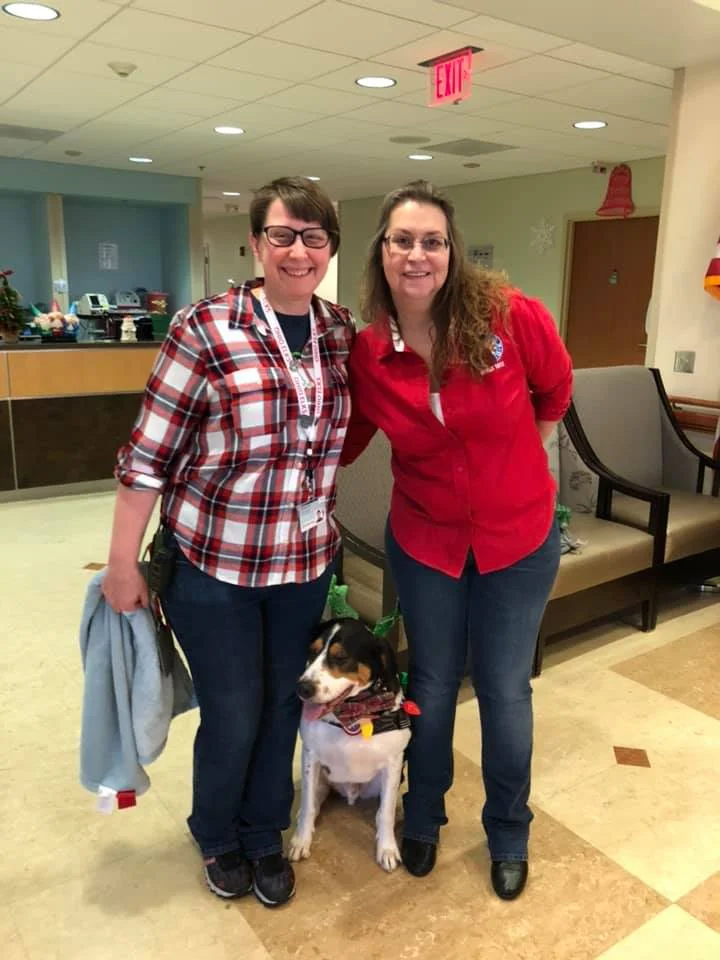 Pictured are Michelle Hill, Linus, and Secretary Danielle Mahany