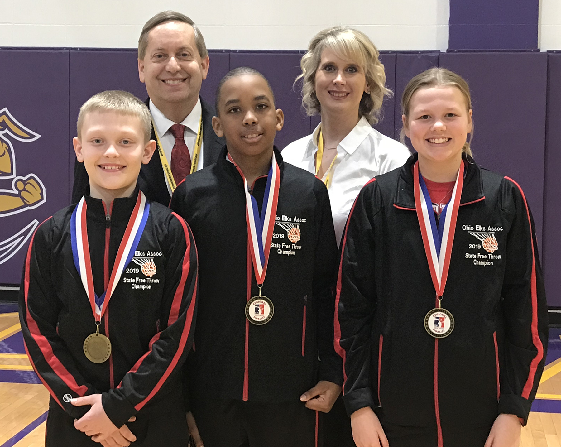 Ohio Hoop Shoot Directors Dennis and Pam Sabo pose with Ohio's three U.S. Region 4 Champions in the Hoop Shoot Free Throw Contest held in Angola, IN on March 16. From left to right are Cameron Elwer, Anthony Thompson, and Jamisyn Stinson.