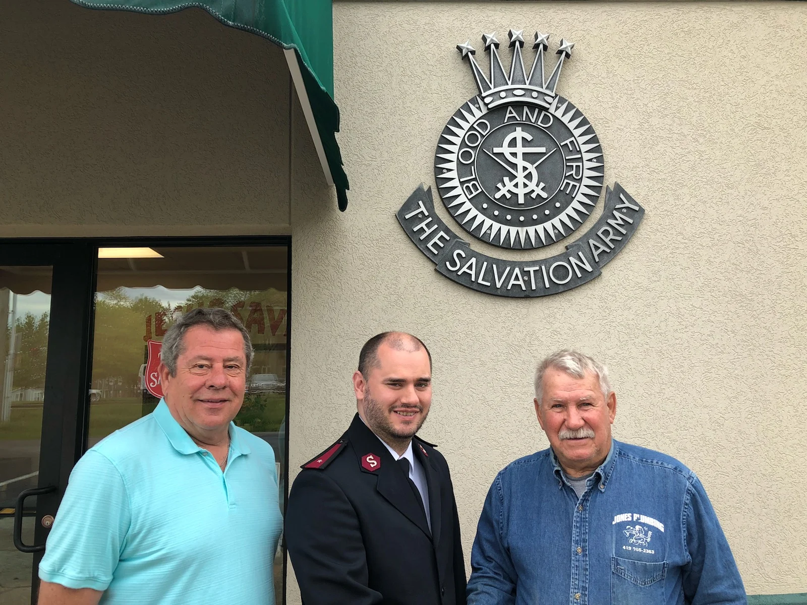 Pictured, left to right are: Jim Sowers, golf committee member; Joshua Bookman representing the Salvation Army and John Jones, golf committee member.