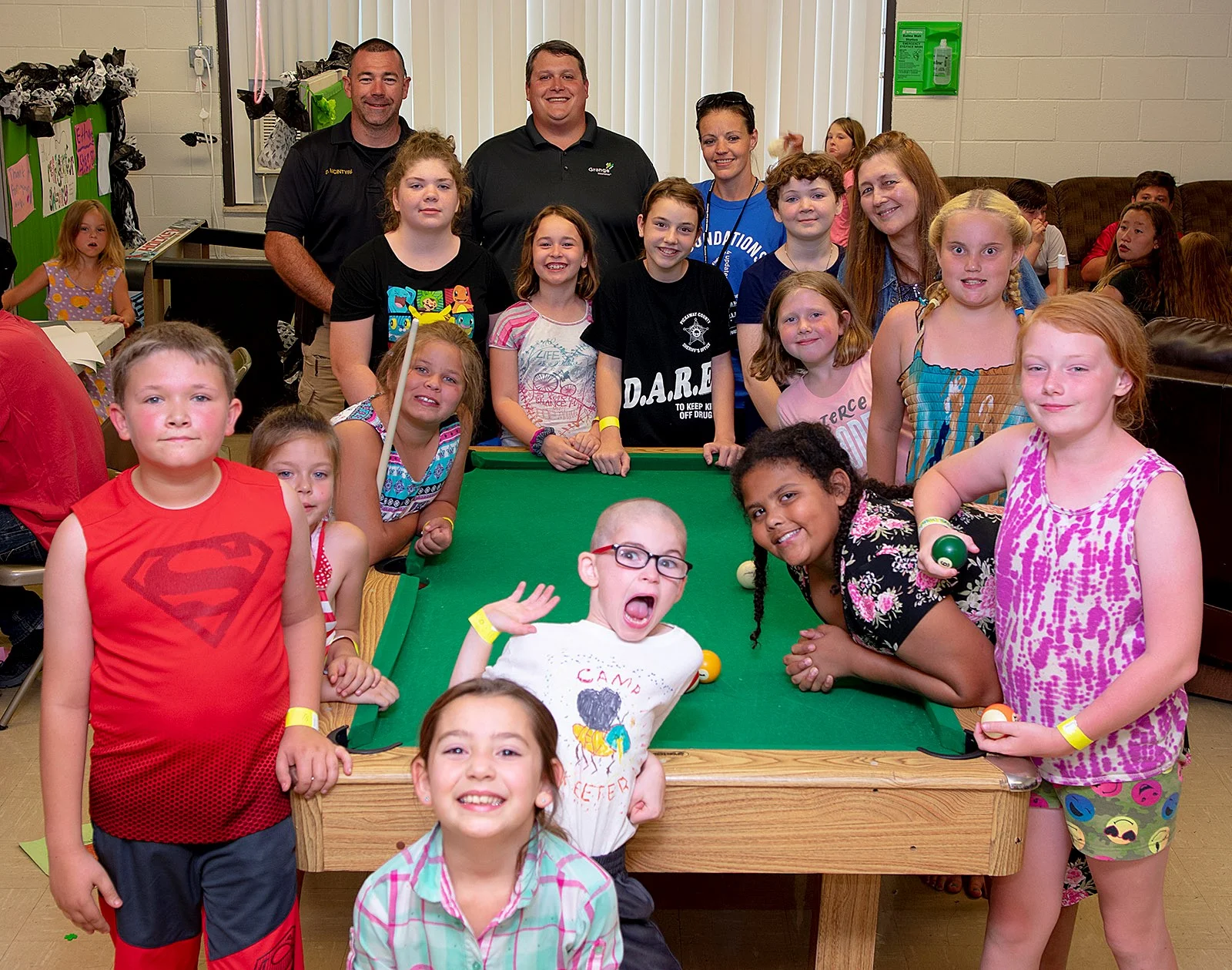 Elks House Committee Chairman Kevin Horstman (back center) presented the donation to Circleville Police Officer David McIntyre (back left) on a night when about 100 kids were enjoying the center. The lodge raised the money by holding a raffle earlier in the year.