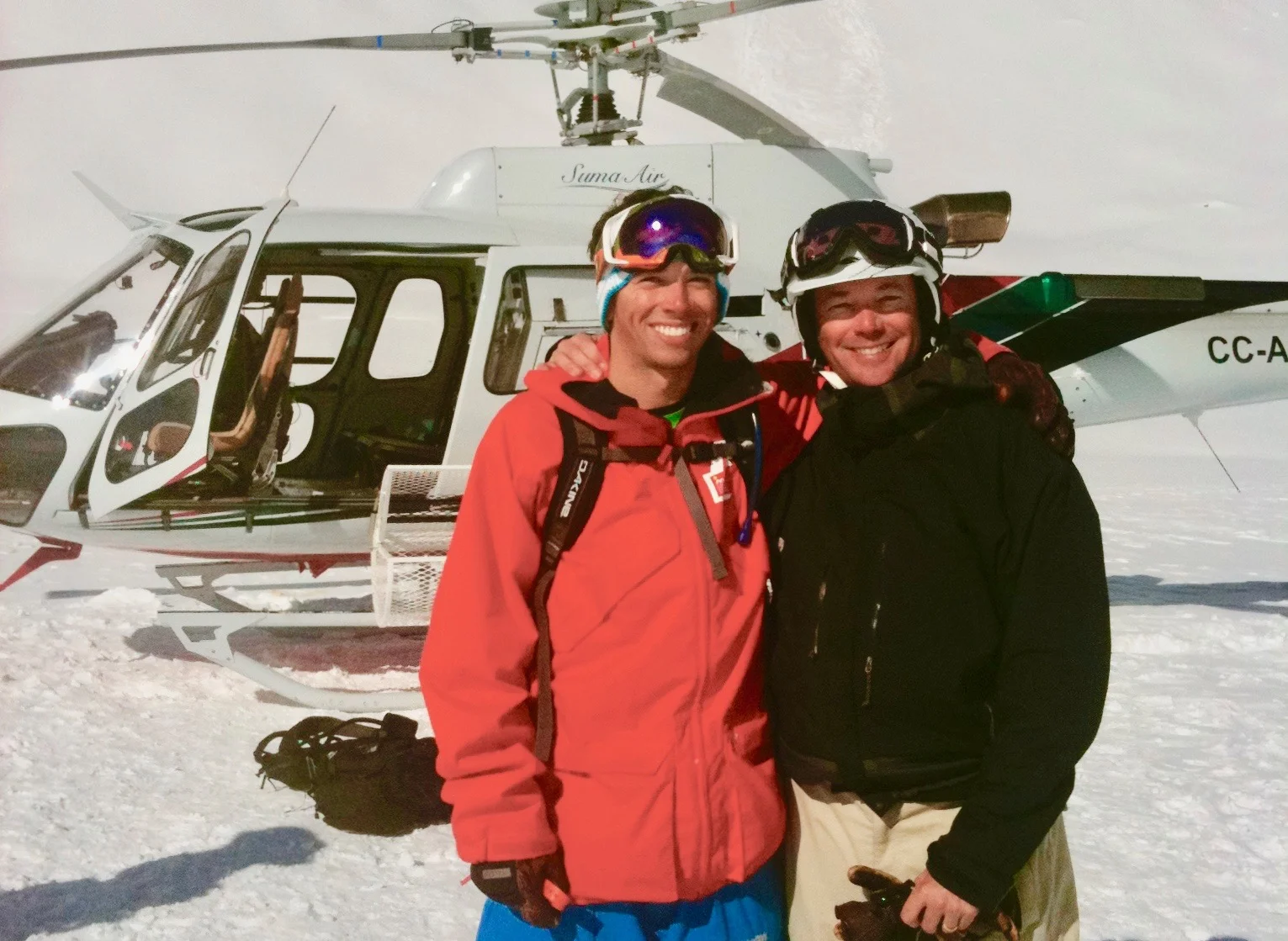 Father and son share a day of heli-skiing in the Andes. 