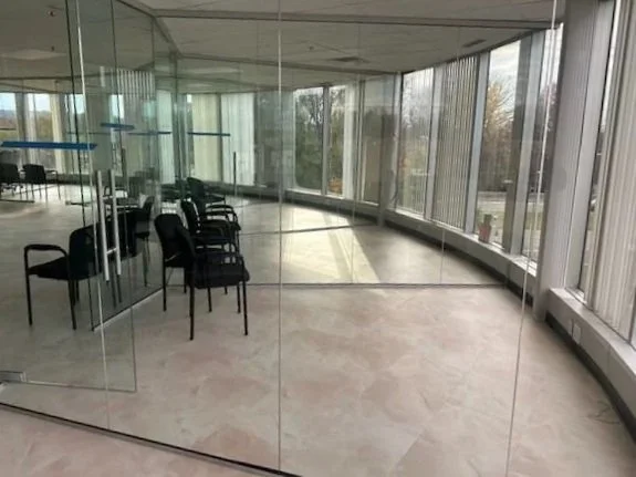 frameless glass divider in office