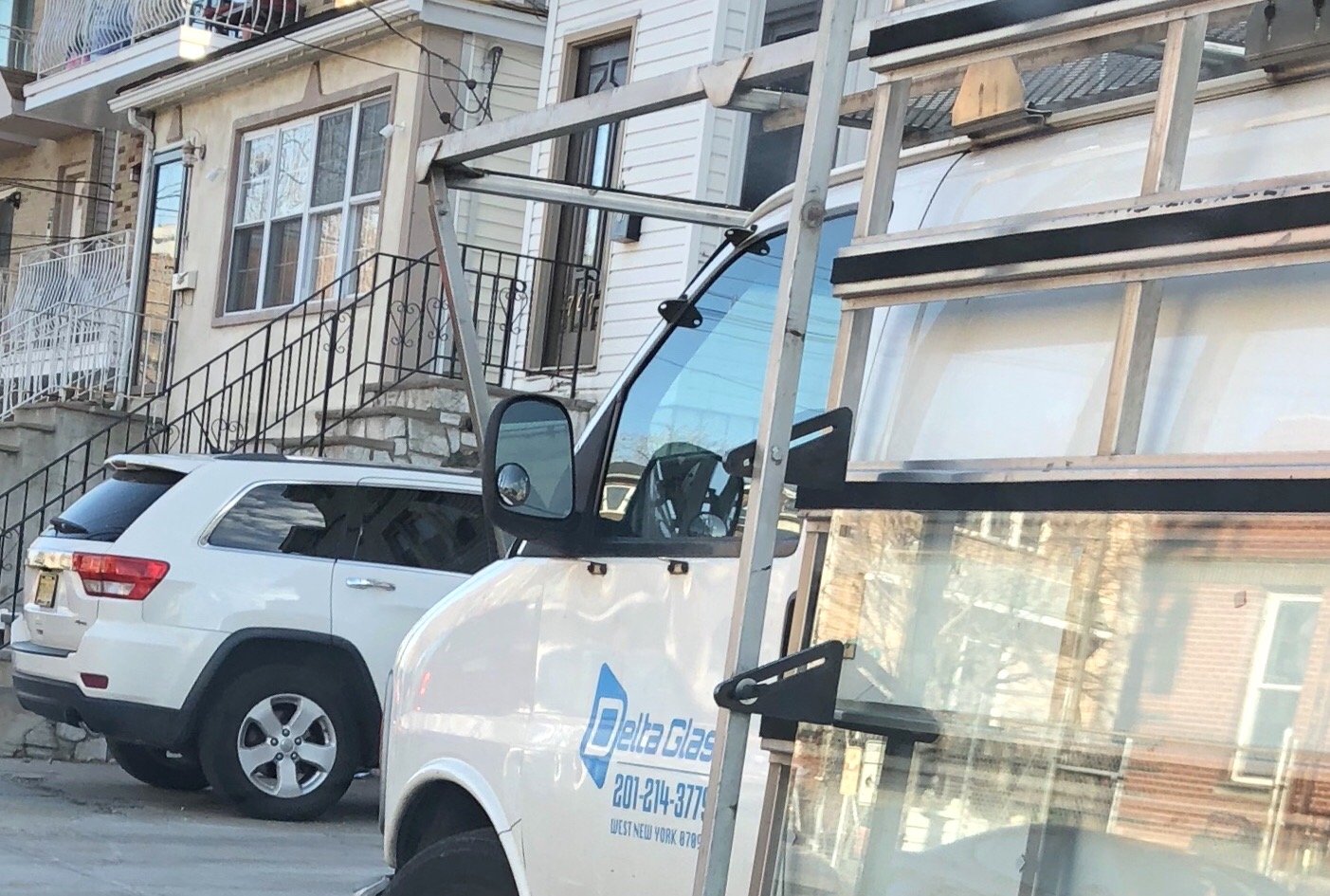 company van with logo on door . Van has a professional glass rack