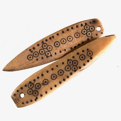 Ethiopian Carved Camel Bone Material: Camel Bone Made from camel femurs or thigh bones, these beads are recycled camel bone from Ethiopia. They feature traditional carvings branded into the bones. The beads are then dipped into a black mixture that gives the indented branded patterns a black color.