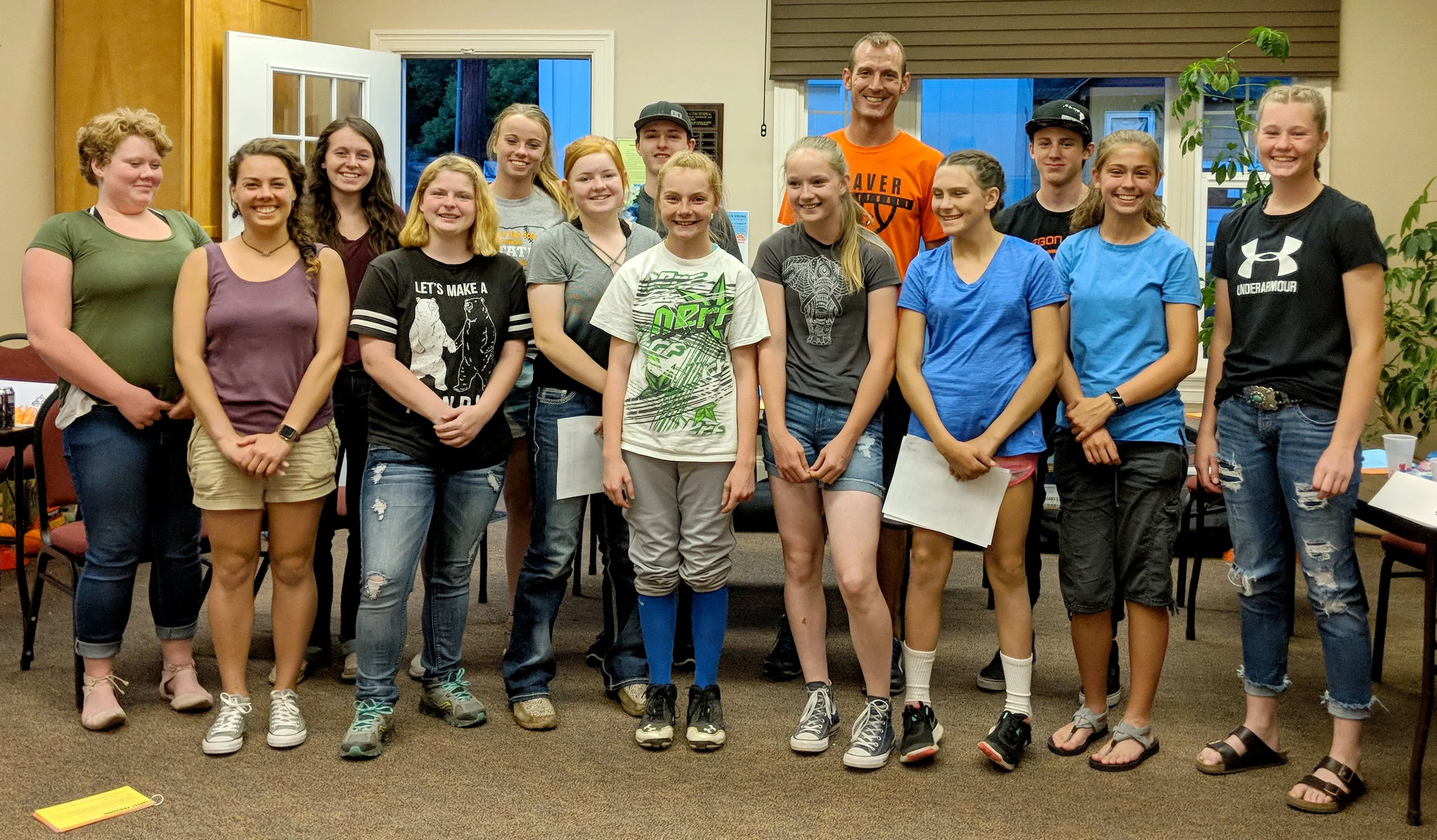i Tri teen staff members pause during training for a photo with their instructors. This group will lead 7- to 12-year-olds in a triathlon training program for Oregon State University Extension this summer. ( Photo courtesy of Samara Rufener, OSU Extension )