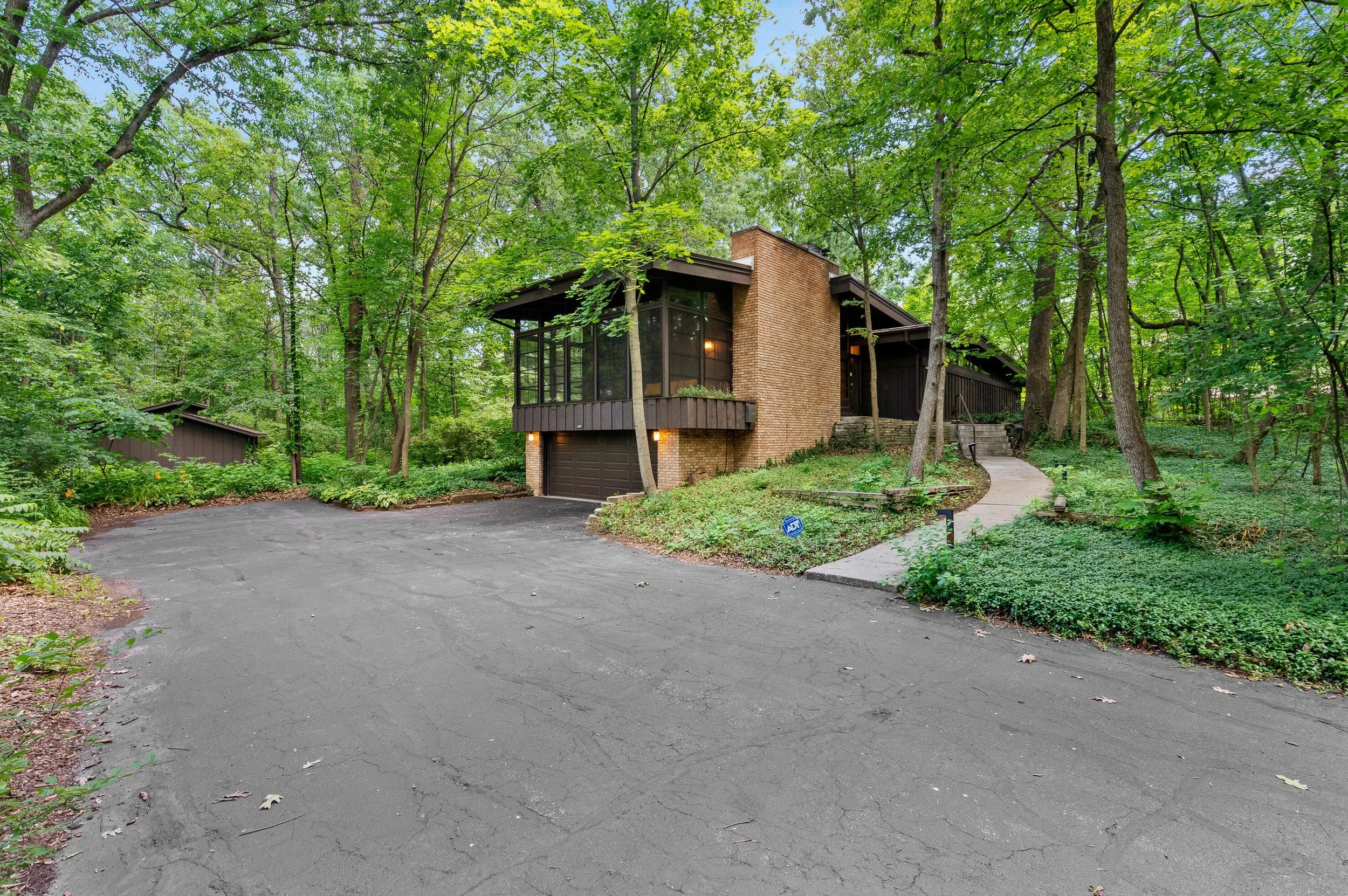 A Woodsy Setting in Hales Corners, WI - $449,900