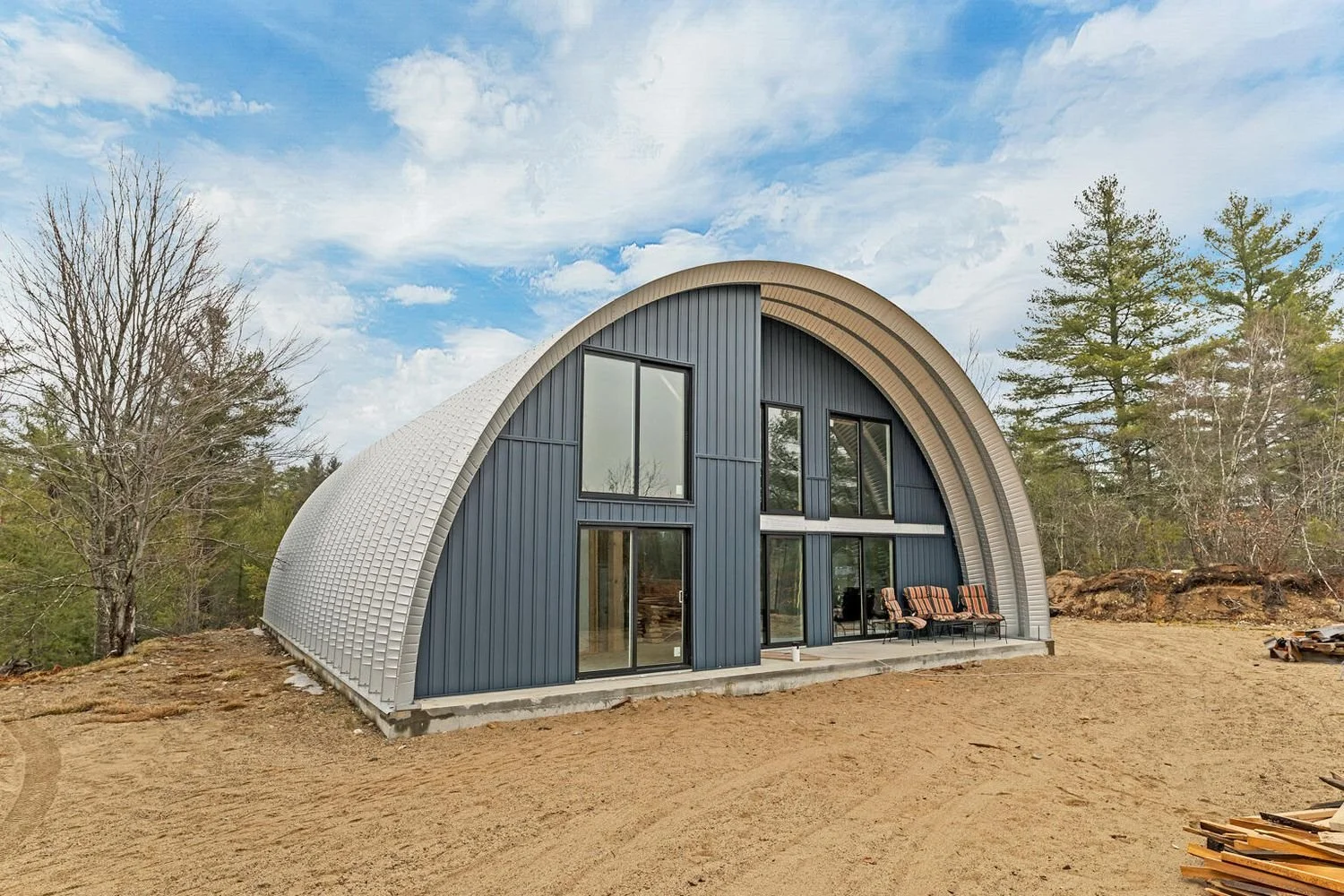 A Unfinished Quonset Hut Style Home on Over 11 Acres - $270,000