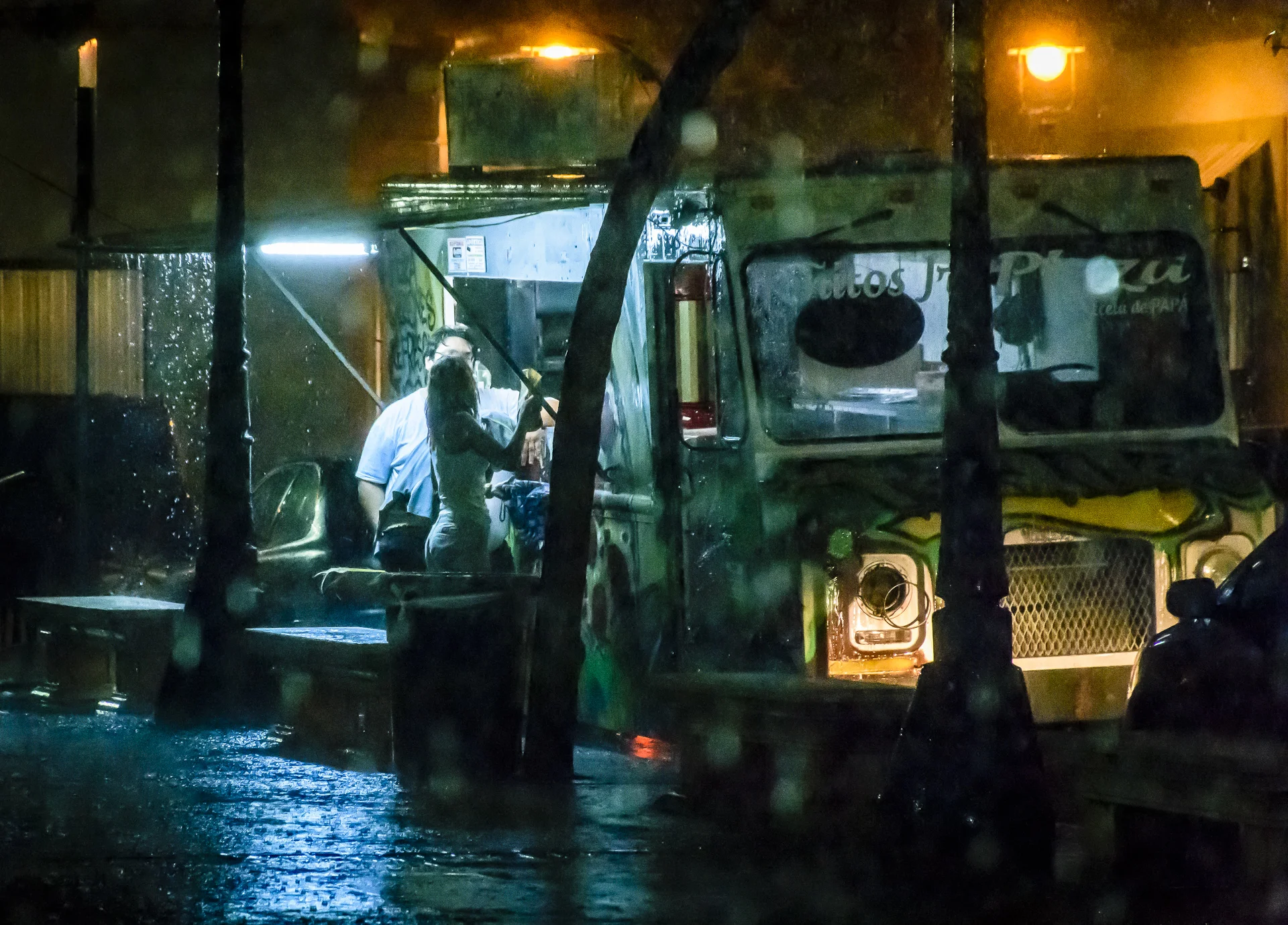 Conversation in an Evening Rain Under a Food Truck Awning, Plaza Las Delicias, Ponce, Puerto Rico, 2017