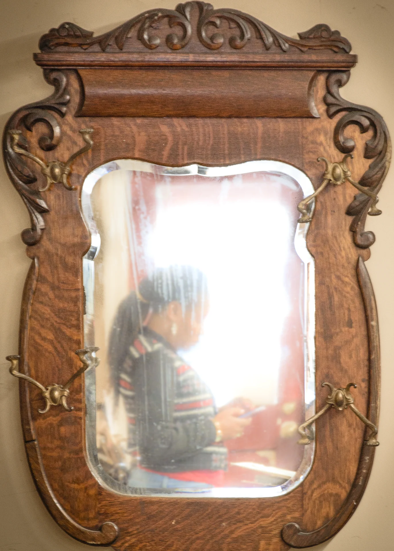 Old Mirror Reflecting Woman in a Window Examining a Picture, Media, Pennsylvania, 2017
