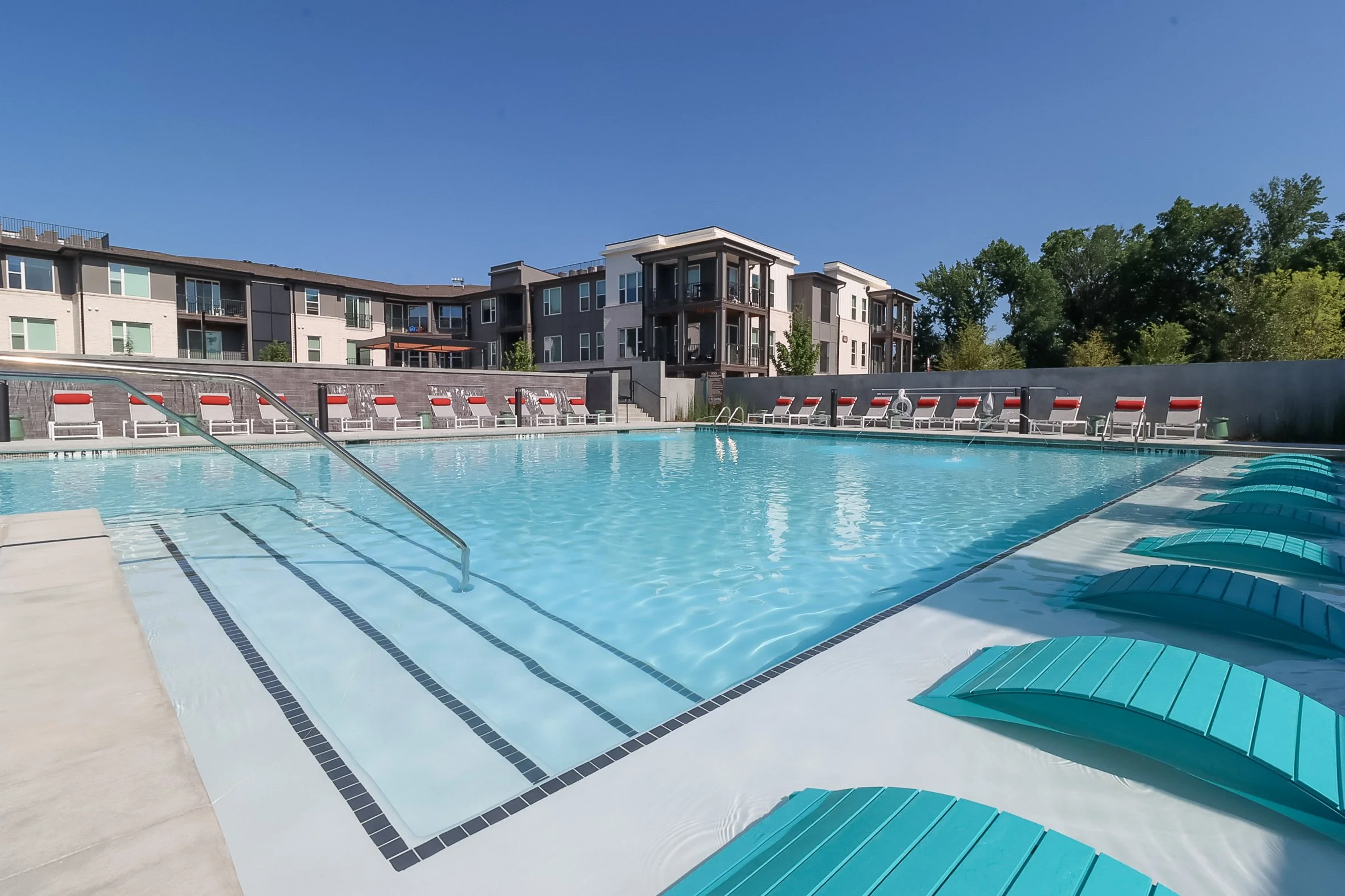 The Wren Apartments pool deck and tanning ledge.jpg