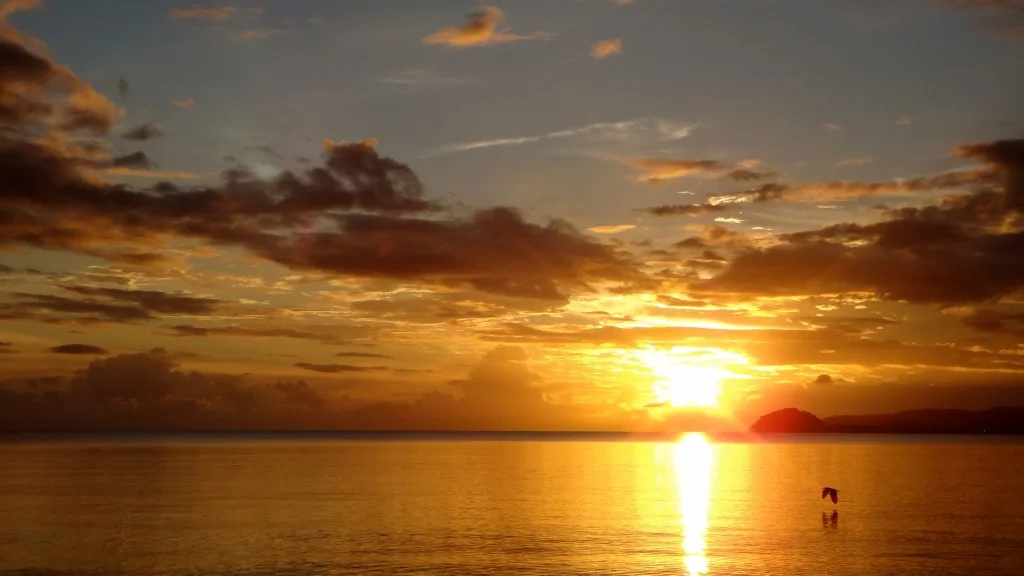 The sun sets over a Fiji Beach wedding.jpg