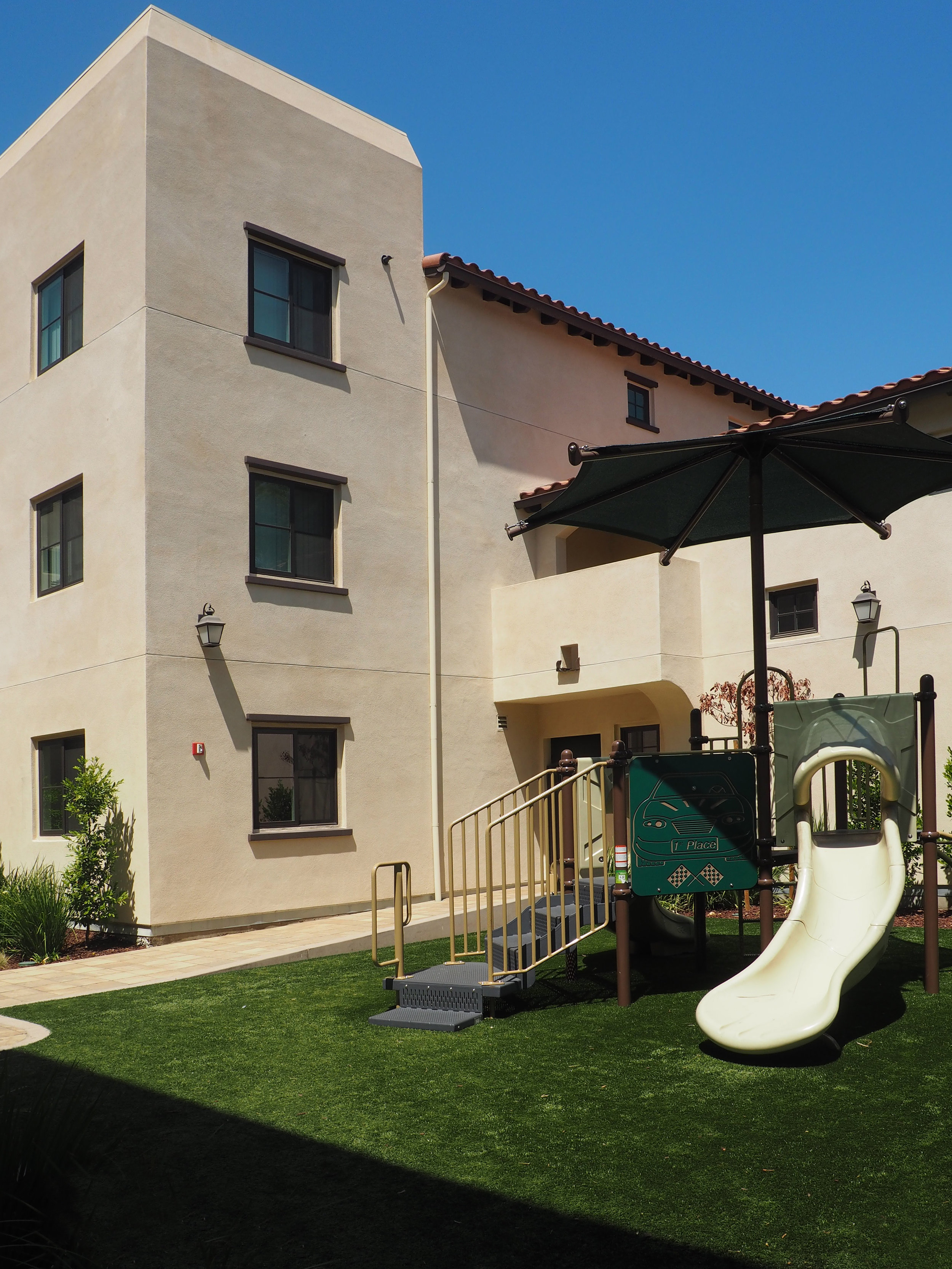 Playground and communal space at Marv's Place Apartments