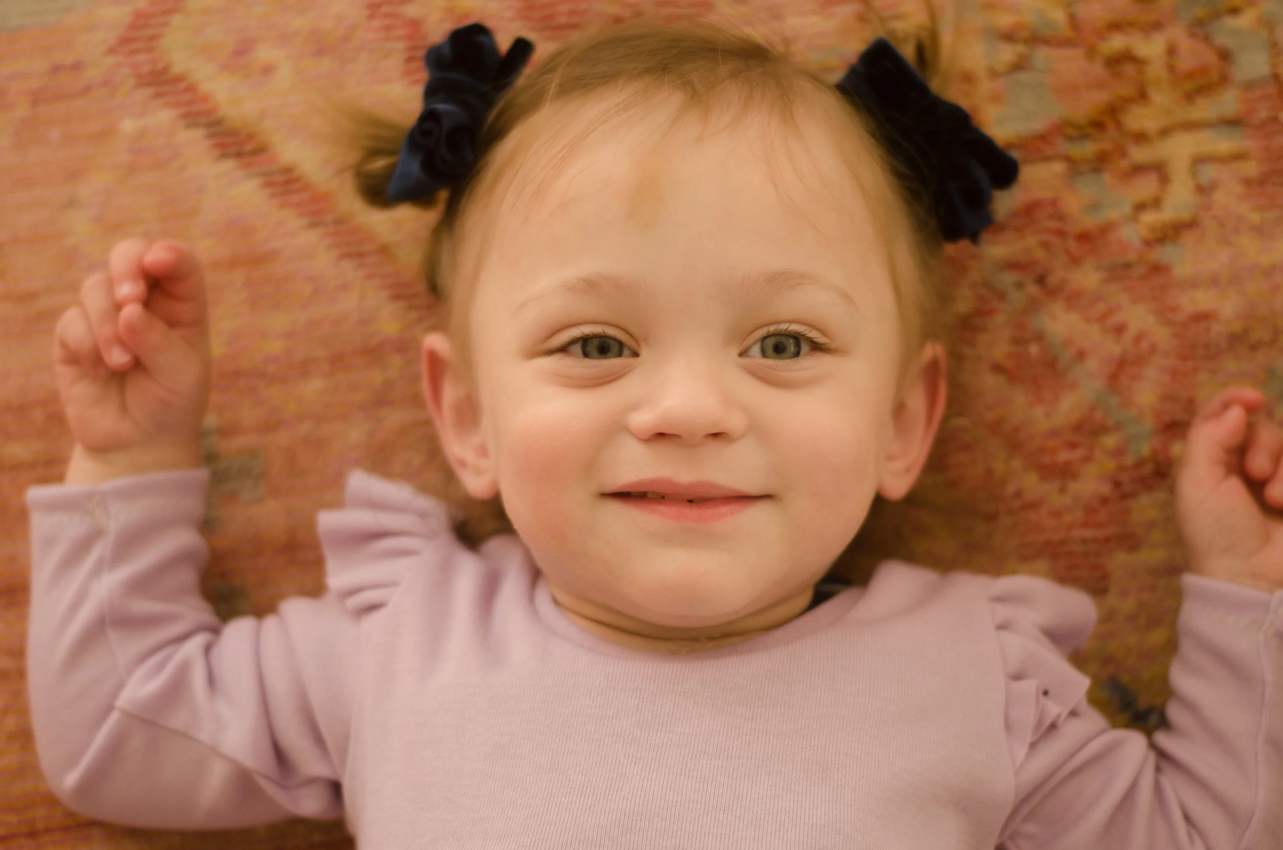 Addie is wearing her very own Boston Strong Bow created by Purple Sunshine Bows . All proceeds of this bow go into our Boston savings account and help our family travel back and forth every 4-6 weeks. You can purchase the bow here .