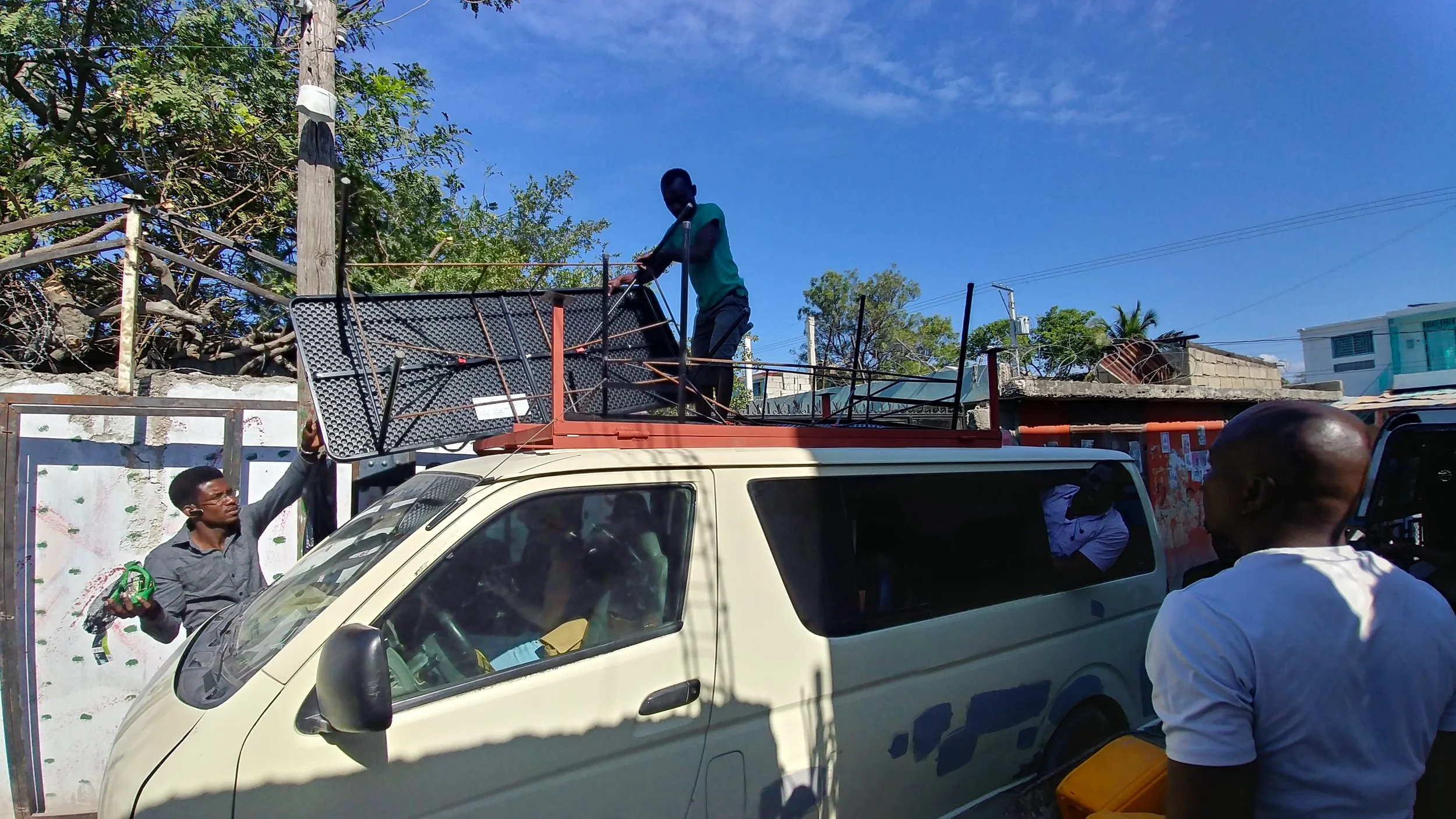 Loading the solar panel frame and reinforced tables onto the van and heading to the school !