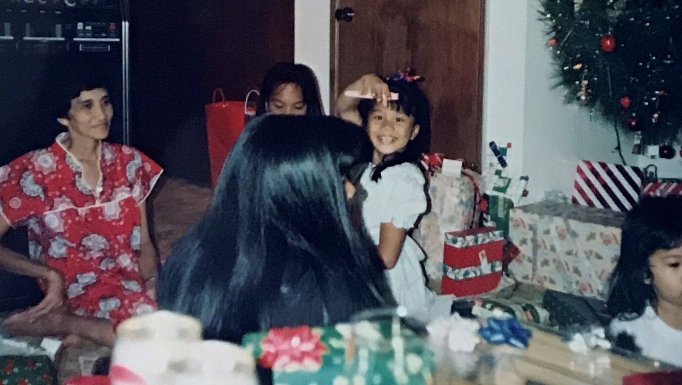 Christmas, 1992 - Holding up the pen to my very first journal while my Auntie Ruby looked on.