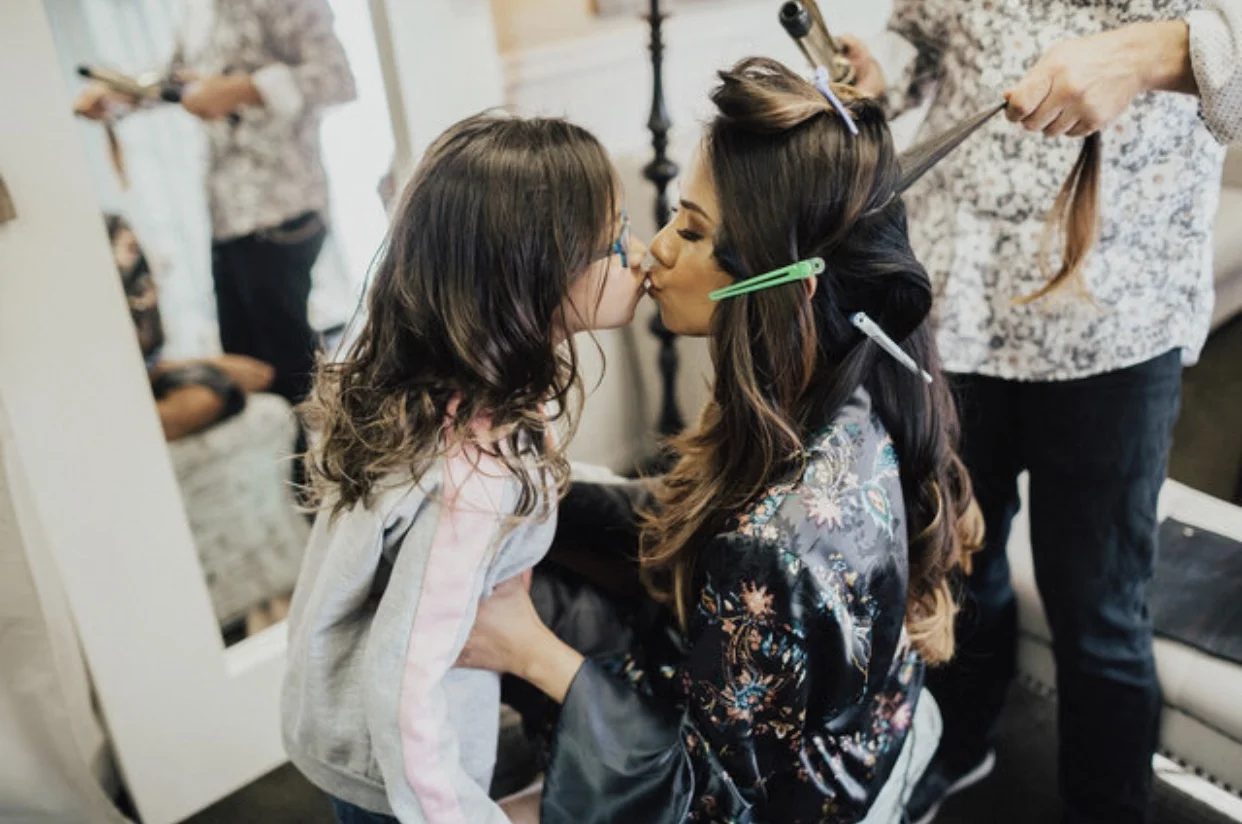 Baby Girl sneaked in a kiss because she wanted my lipstick color on her lips, too.