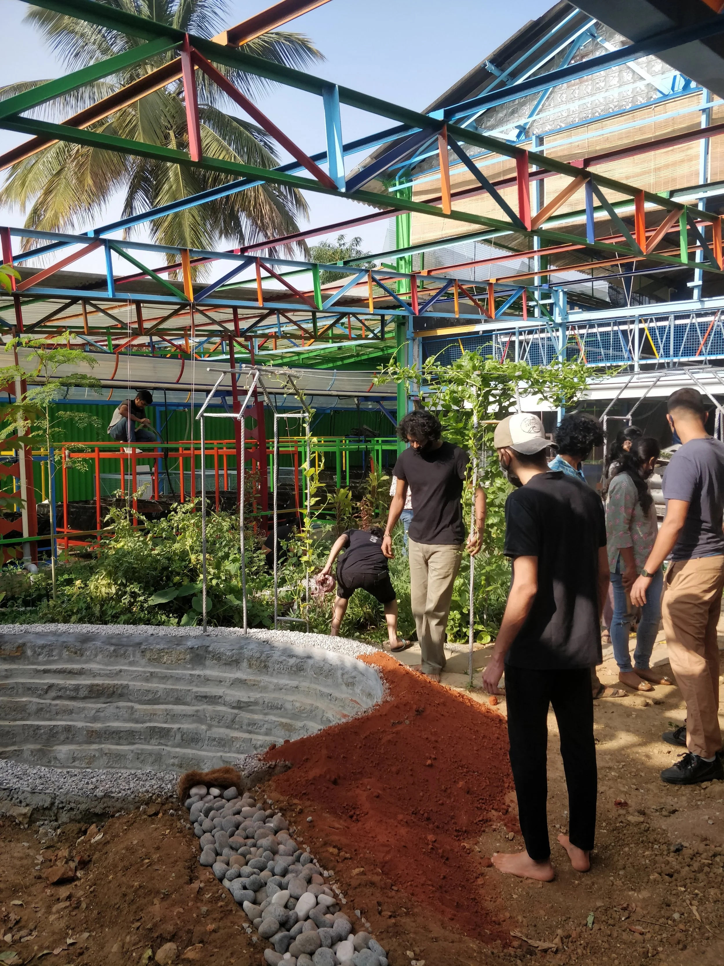 Forming a berm around the pond