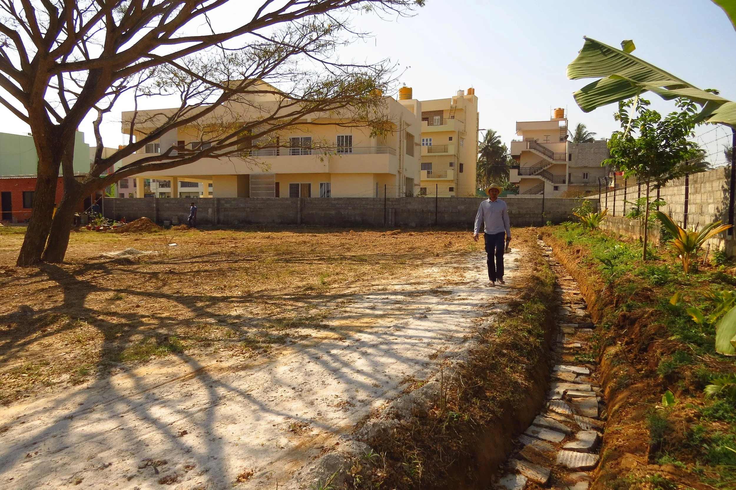 Rock-lined trenches and western living fence