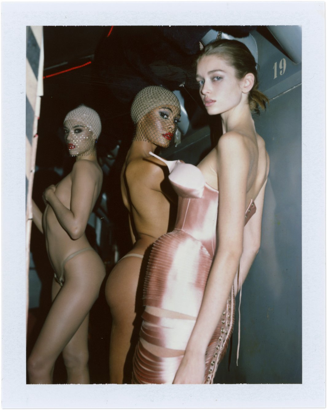  Stella Hanan poses with Crazy Horse performers in Paris for Harper’s Bazaar France’s haute couture editorial, photographed by Sean Thomas. 