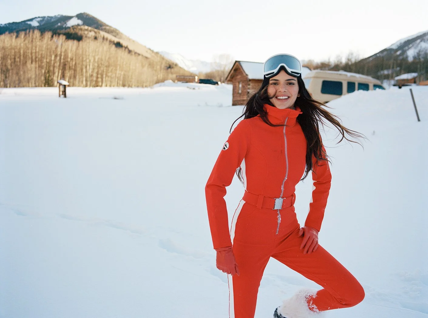  Kendall Jenner in a red ski suit against the snowy Aspen landscape for FWRD, photographed by Sean Thomas. 