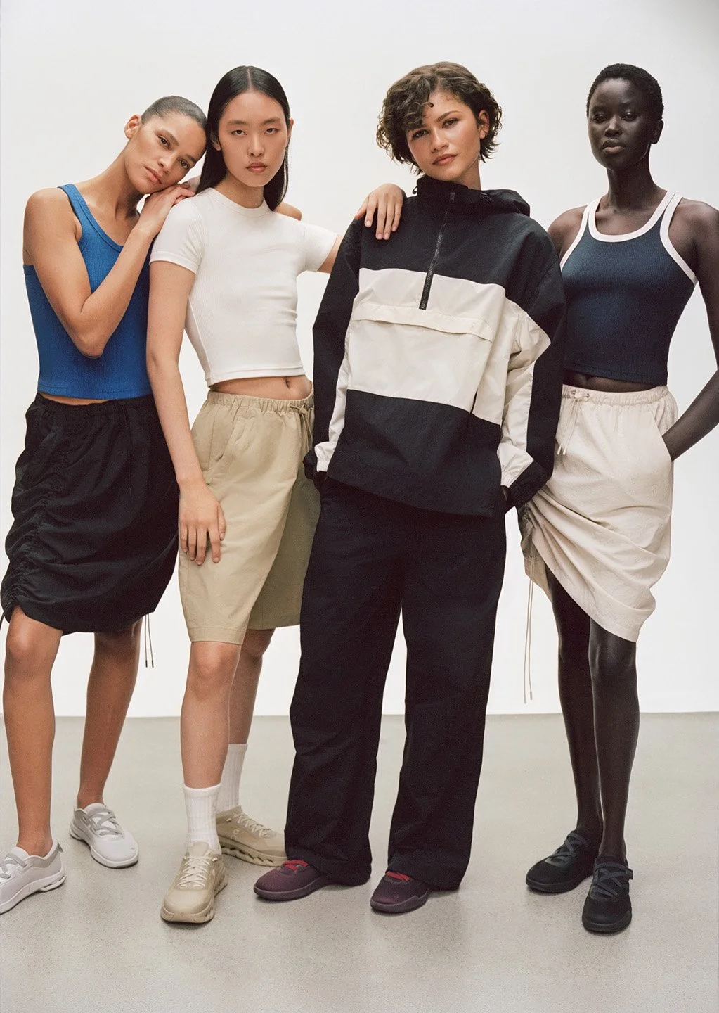  Zendaya with three models wearing On apparel and footwear in a London studio, photographed by Sean Thomas for On. 