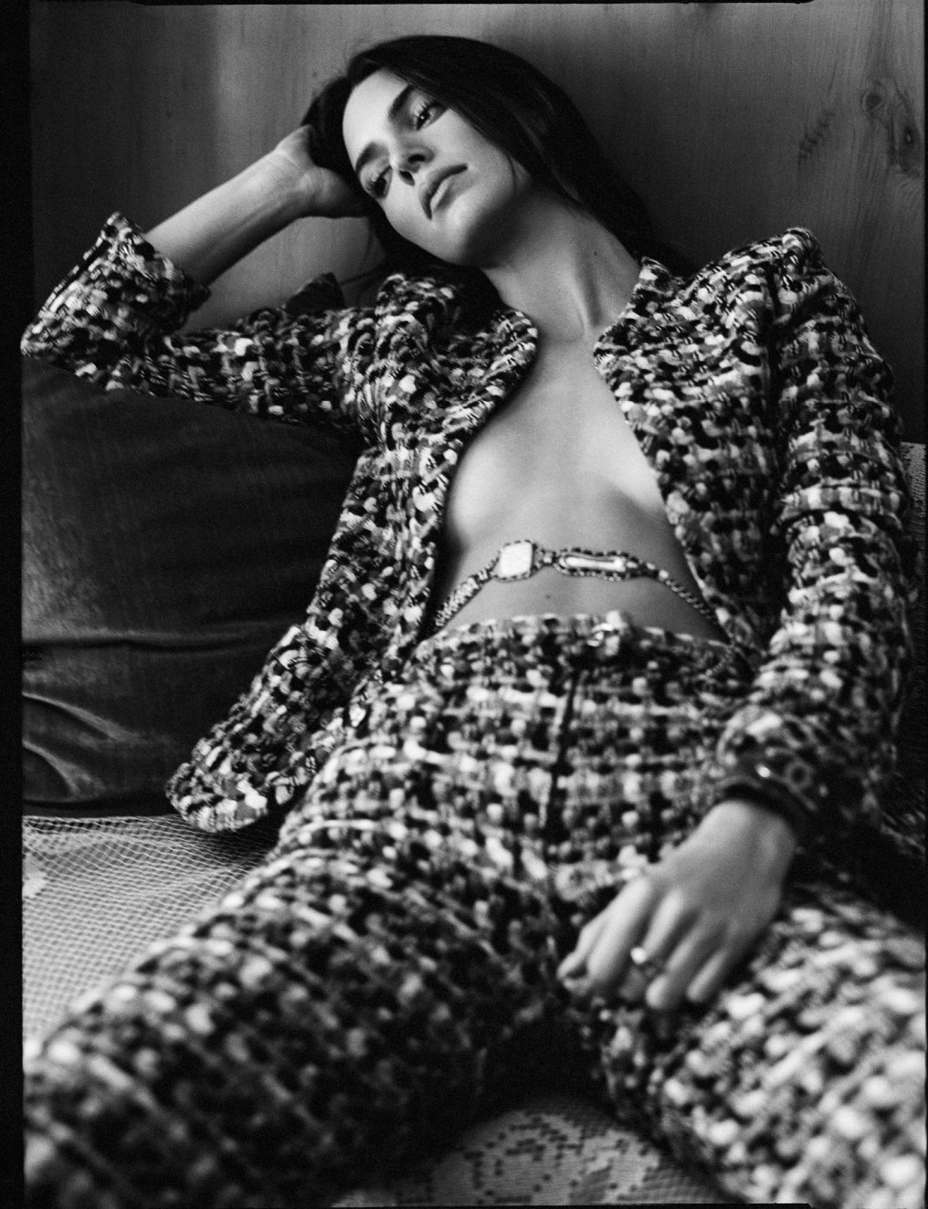  Black-and-white portrait of Kendall Jenner reclining in a tweed suit, photographed by Sean Thomas for WSJ. Magazine in Los Angeles. 