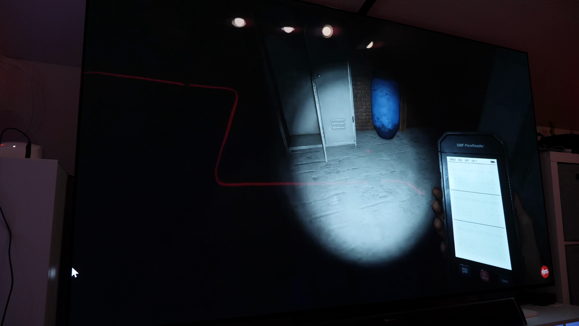 Phasmophobia footage shown on a monitor in the source video