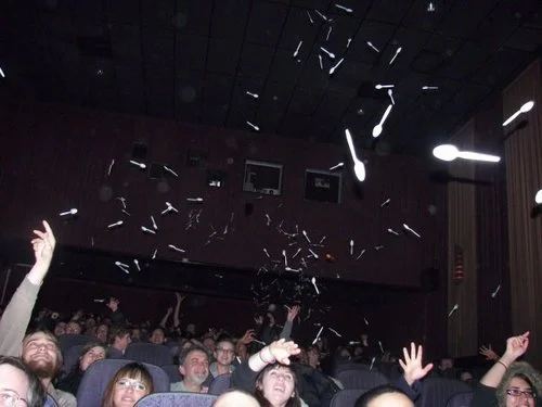 Cinema goers commonly throw spoons at the screen when they see them in The Room