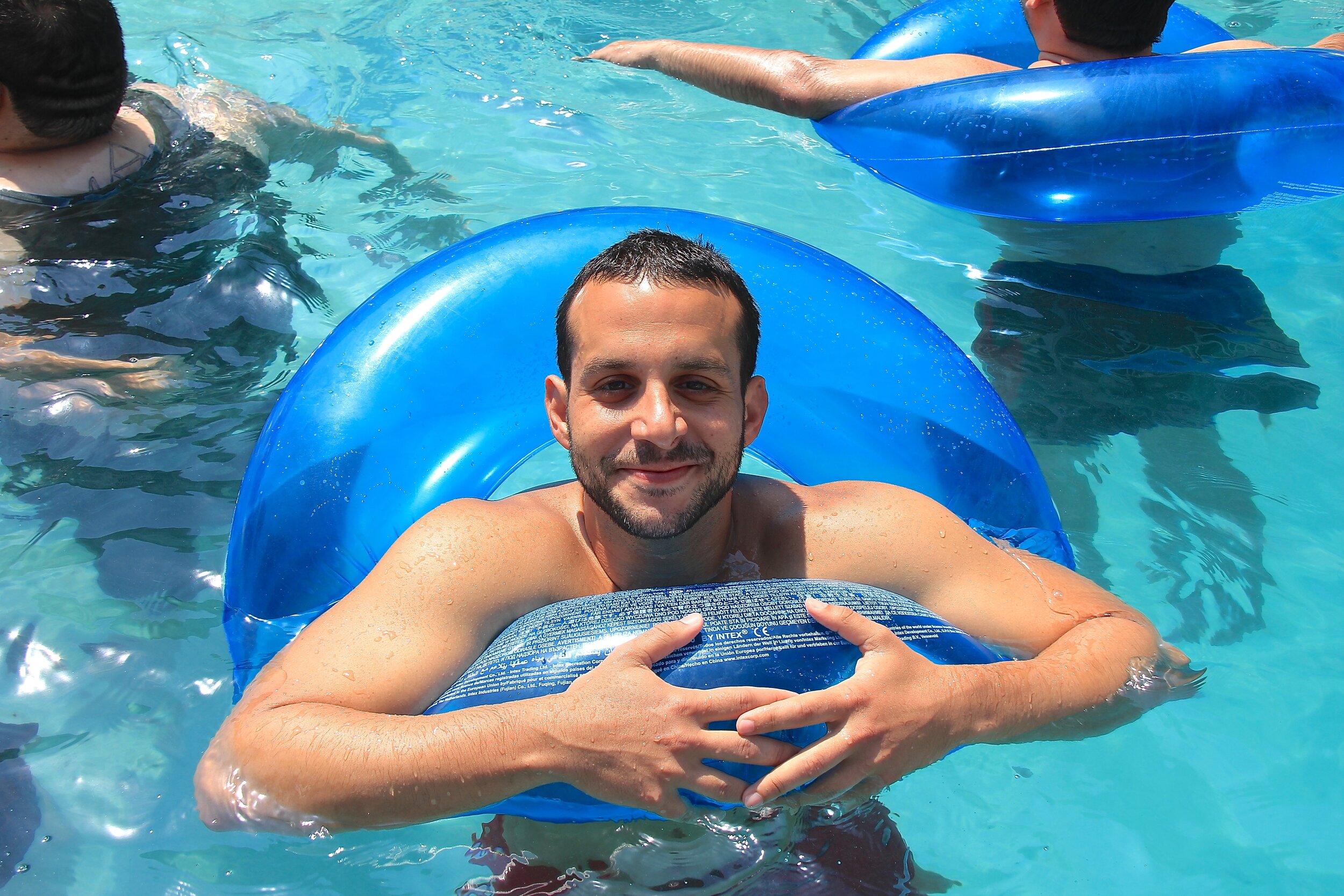 smiling guy in blue float.jpg