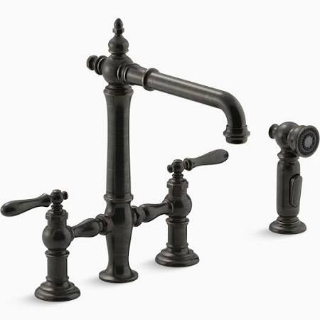 Kitchen Sink Faucet Kohler Artifacts Series, Bridge Faucet with Sidespray, Oil Rubbed Bronze The Artifacts faucet collection brings you classic designs reimagined in fresh new ways for various task areas of the kitchen. Featuring a compact profile ideal for a secondary sink, this Artifacts bridge faucet celebrates vintage style with its lever handles and Victorian-inspired swivel spout. A convenient sidespray lets you switch from gentle BerrySoft® spray to powerful Sweep® spray at the touch of a button, so you're set for food prep as well as quick cleanup.