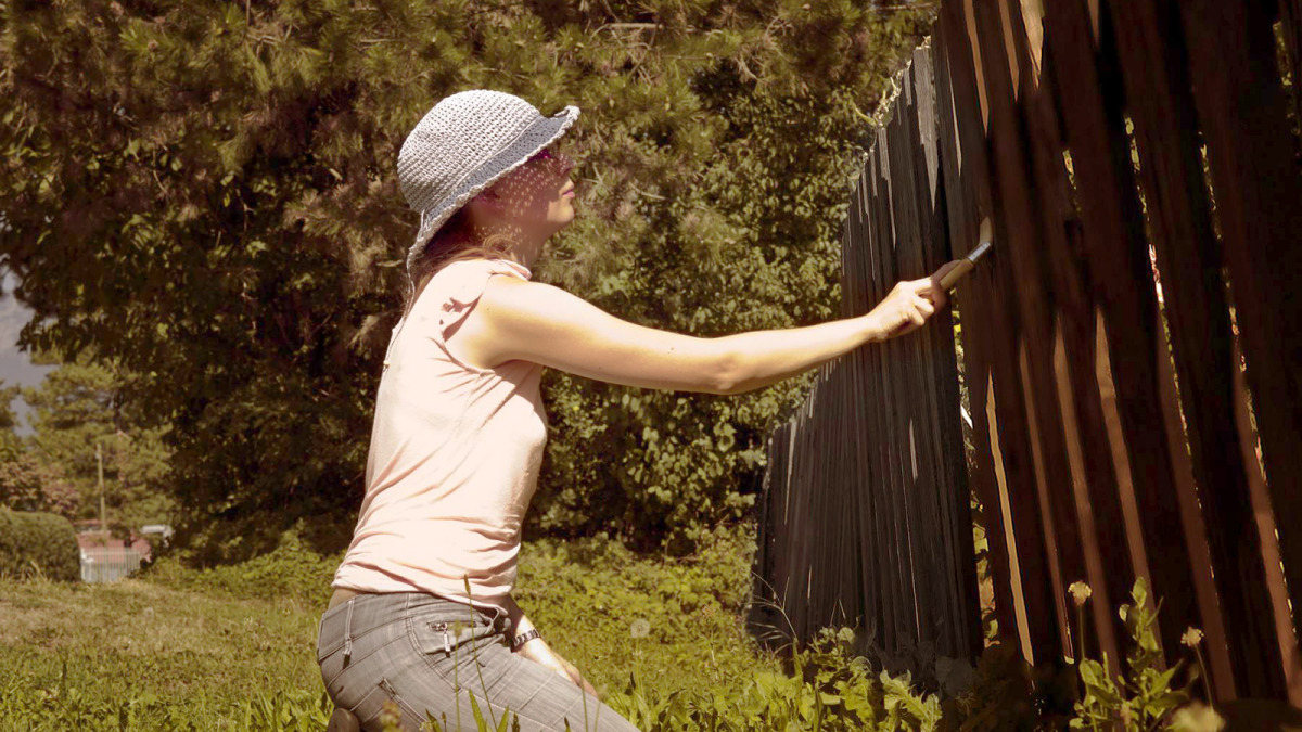 woman-painting-fence.jpg