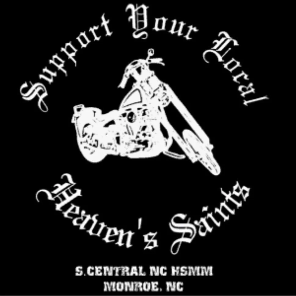 Black background with a white outline image of a motorcycle. Text above the motorcycle says "Support Your Local" in a curved arc. Text below the motorcycle says "Harley's Saints" in a curved arc. Additional text at the bottom reads "S. CENTRAL NC HOGWAM," and "MONROE, NC."