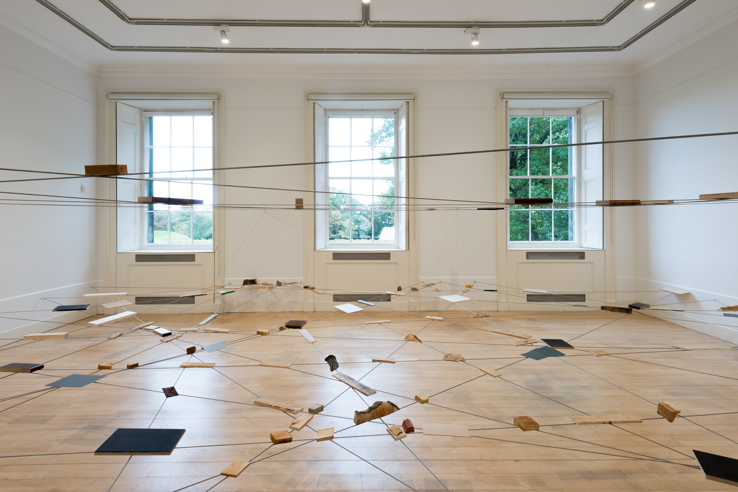 Left-Behind Situation , 1972/2016 捨置状況 ( Shachi Jōkyō ) Wood, stone, brick, zinc, bark, wire rope Dimensions variable Installation view, Karla Black and Kishio Suga; A New Order , Scottish National Gallery of Modern Art, Edinburgh, 2016 Photo: Sam Drake; Courtesy National Galleries of Scotland