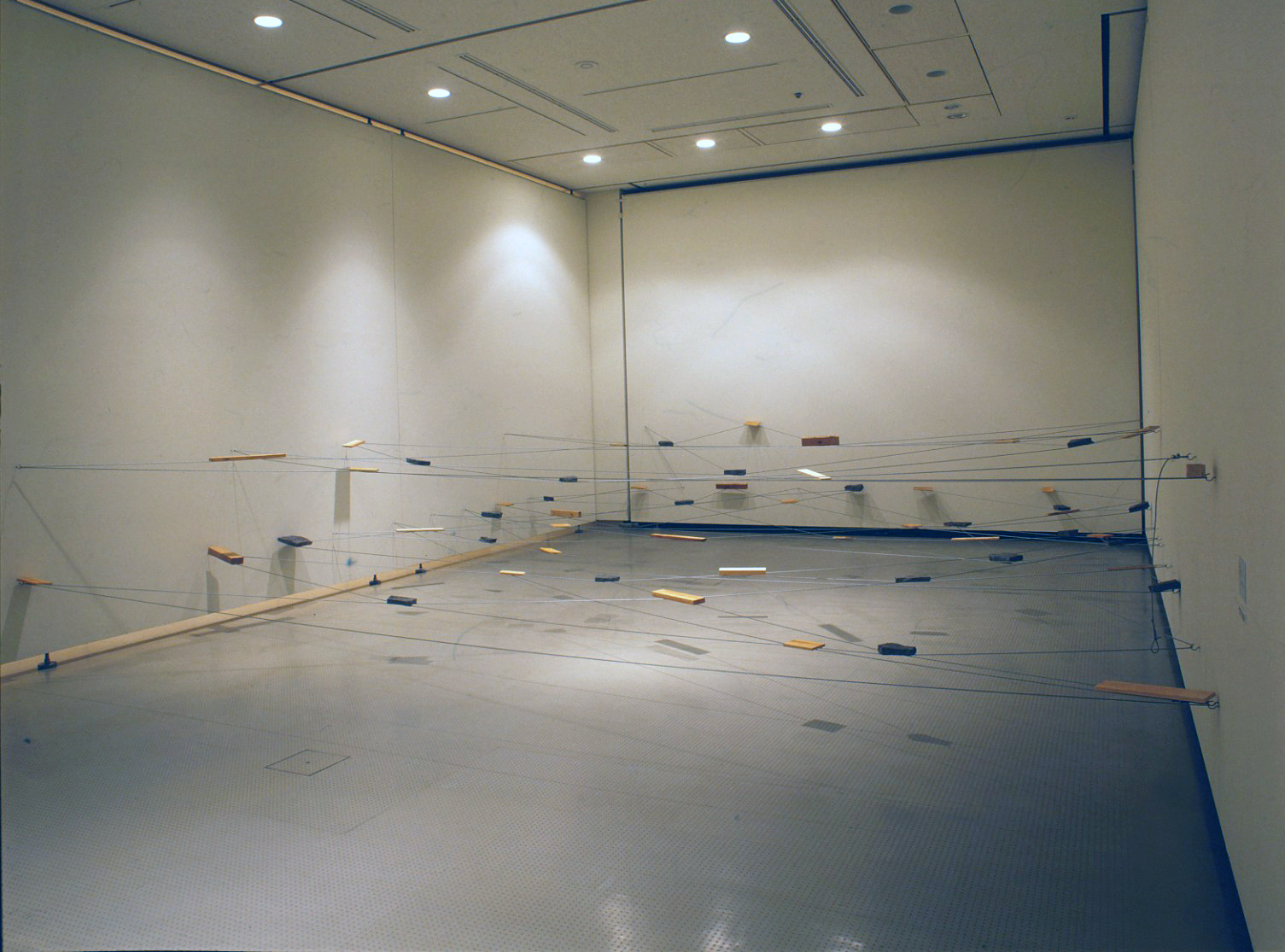 Left-Behind Situation , 1972/1995 捨置状況 ( Shachi Jōkyō ) Wood, stone, wire rope Dimensions variable Installation view, Matter and Perception 1970: Mono-ha and the Search for Fundamentals , Hiroshima City Museum of Contemporary Art, 1995 Photo: Tsuyoshi Satoh