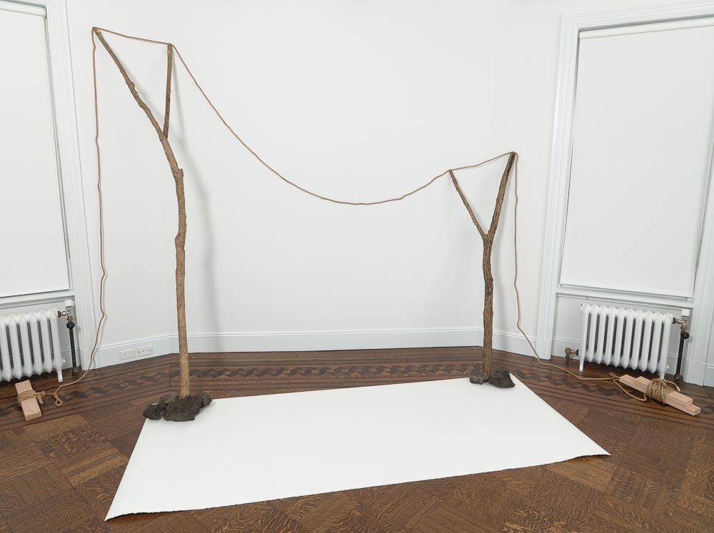 Continuous Existence—N , 1977/2015 連界—N ( Renkai—N ) Rope, branches, stones, paper Dimensions variable Installation view, Blum & Poe, New York, 2015 Courtesy Blum & Poe, Los Angeles / New York / Tokyo