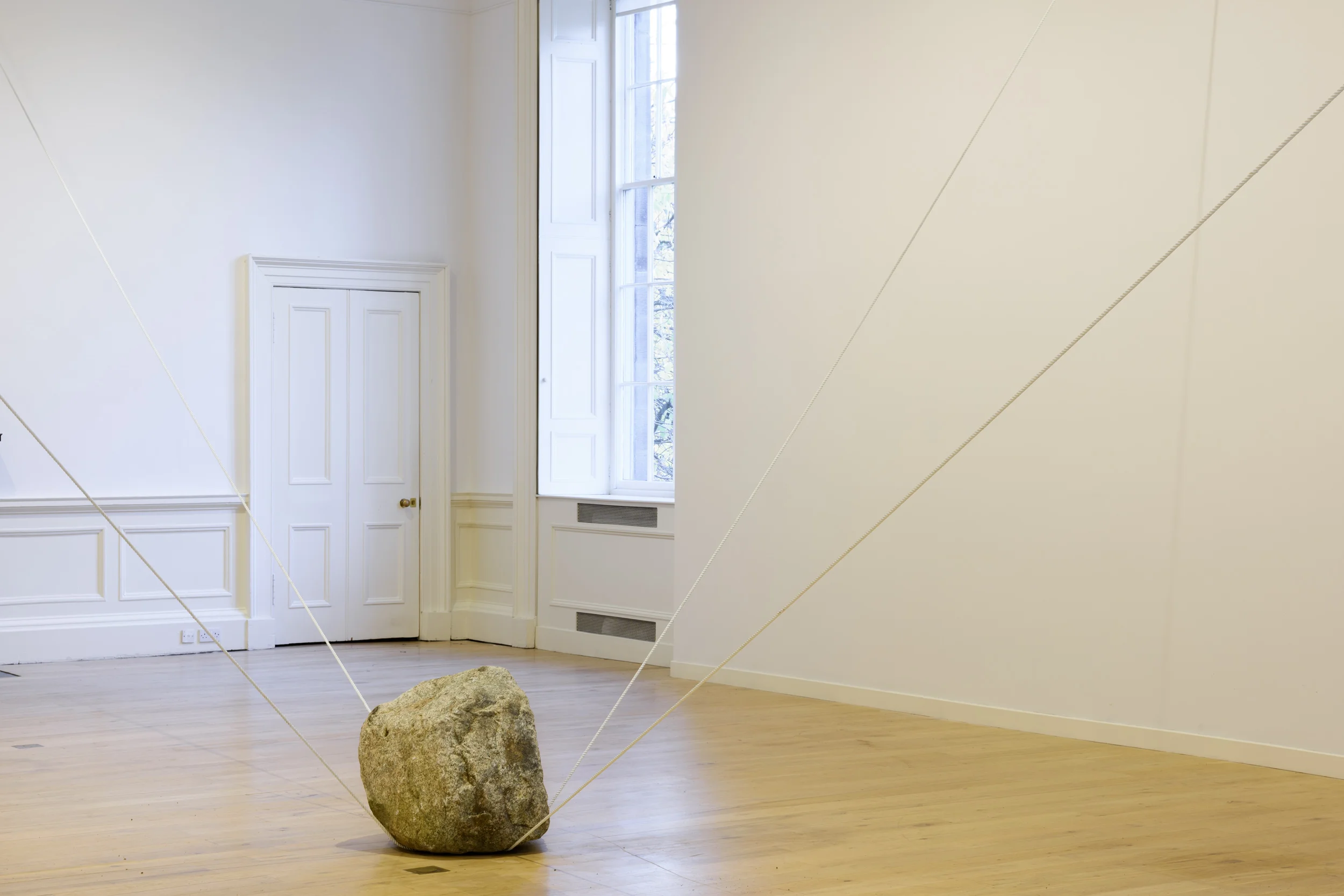 Interconnected Spaces , 2016 空連化 ( Kūrenka ) Stone, rope Dimensions variable Installation view, Karla Black and Kishio Suga: A New Order , Scottish National Gallery of Modern Art, Edinburgh, 2016 Photo: Sam Drake; Courtesy National Galleries of Scotland