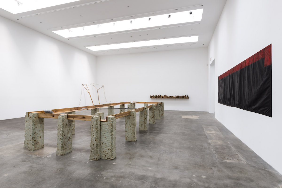 Supported Surrounding , 1987 縁辺仕帯 ( Enpen Shitai ) Wood planks, stone, aluminum 41 3/8 x 103 3/4 x 305 1/2 inches overall Installation view, Blum & Poe, Los Angeles, 2012 Photo: Joshua White/JWPictures.com Courtesy Blum & Poe, Los Angeles / New York / Tokyo