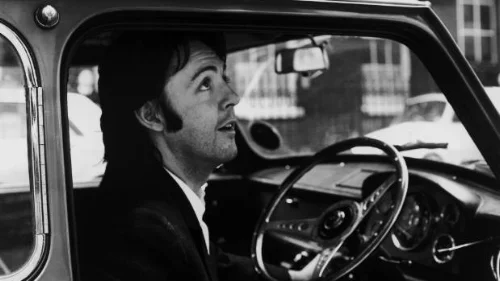 Paul McCartney leaving the Apple headquarters in London, 19th April 1969..jpg