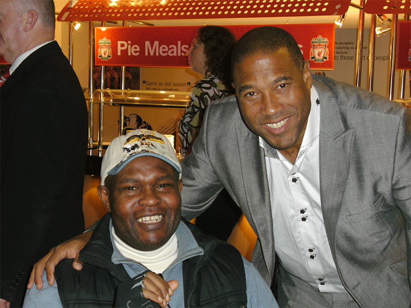 Ayo Falana (Co-Volunteer Founder & Global Ambassador – LSFH/MAPFest.org) and John Barnes ( A LFC Legend) introducing “LEADING SUPPORT FOR HUMANITY” (LSFH) at a LFC Charity Event.