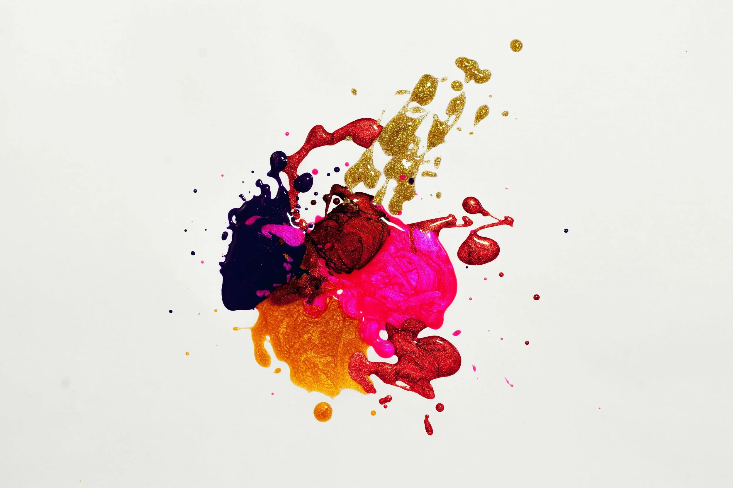 A mix of purple, red, orange, pink and gold paint in one blob. Represents perfectionist tendencies during trying to conceive and anxiety therapy in Seattle.