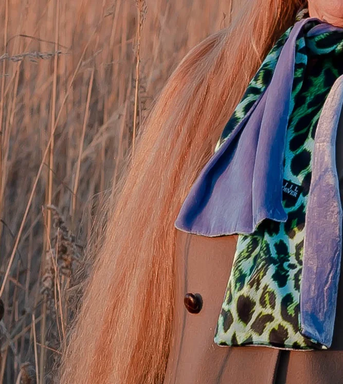 Glowing locks paired with Jil Dever’s “Park Oblong Scarf in Lilac Velvet with Leopard Printed Silk” - the ideal weight and warmth for cool days or nights, this reversible scarf instantly elevates casual looks.