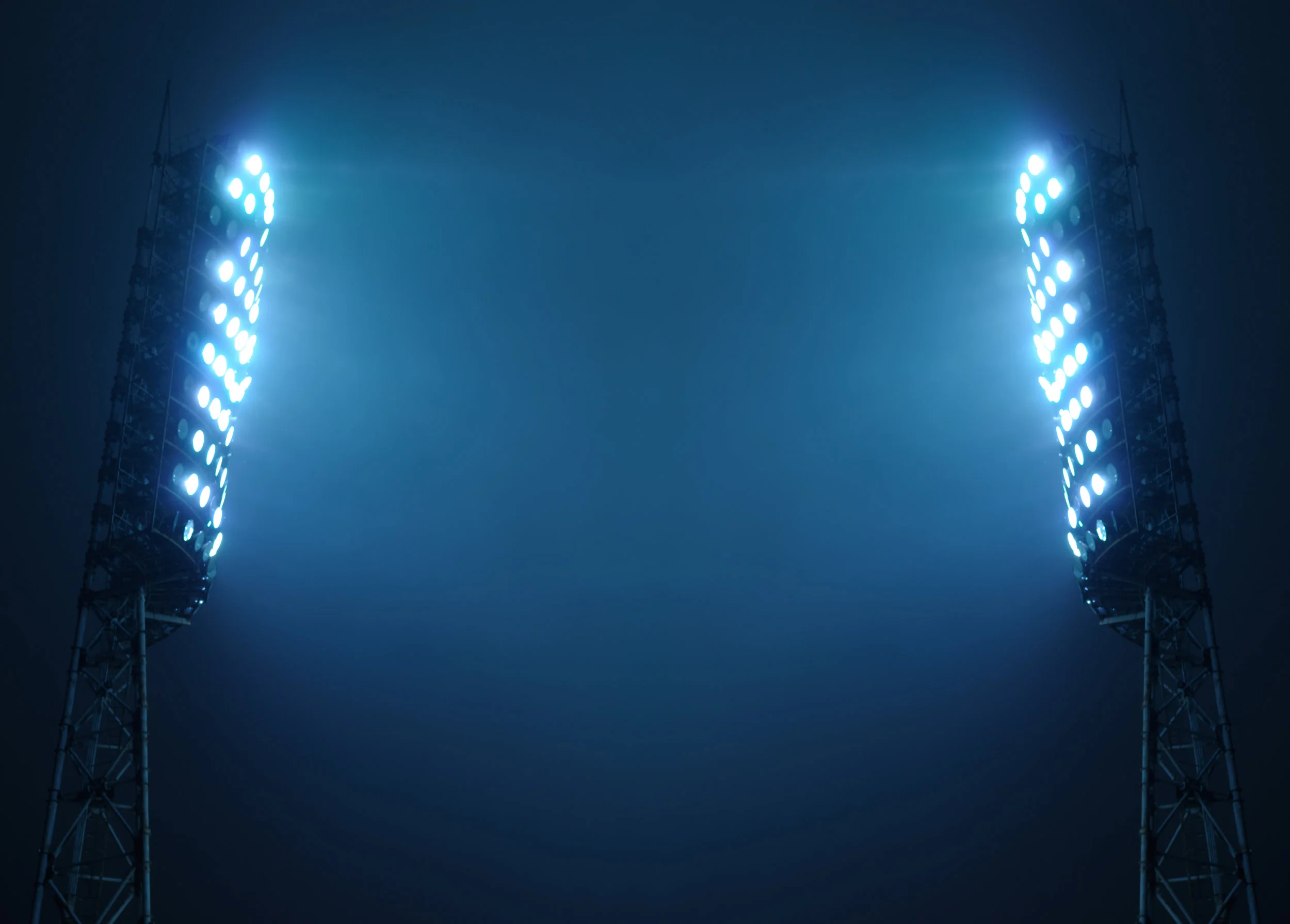 Stadium Lights against Dark Night Sky with Copy Space