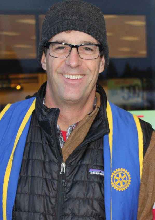 Rotarian Jon Davies ringing the bell for Salvation Army